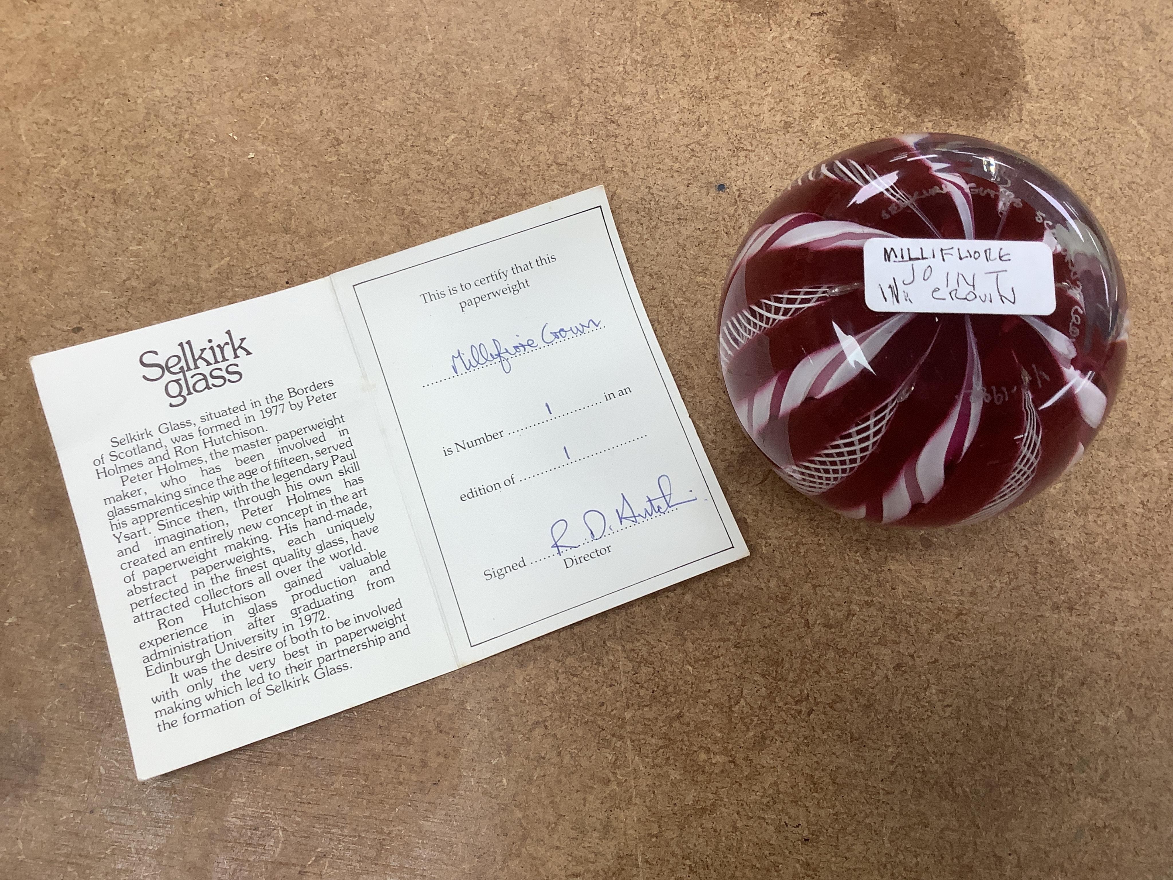 Two Perthshire glass Christmas paperweights for 1981 and 1983, a Perthshire miniature Latticino weight, 18/400, dated 1982, and a Selkirk glass Millefiori crown paperweight, 1982, (4) Largest Perthshire paperweight 8cm